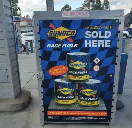 A sign advertising sunoco race fuels sold here.